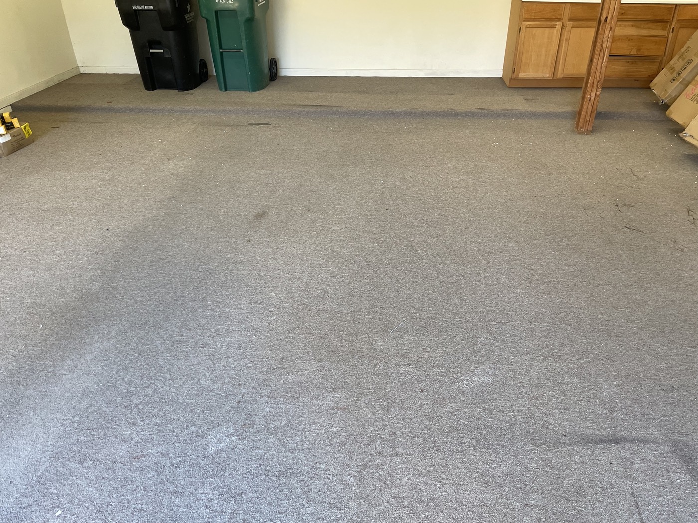 Residential garage before the blue and grey metallic floor installation