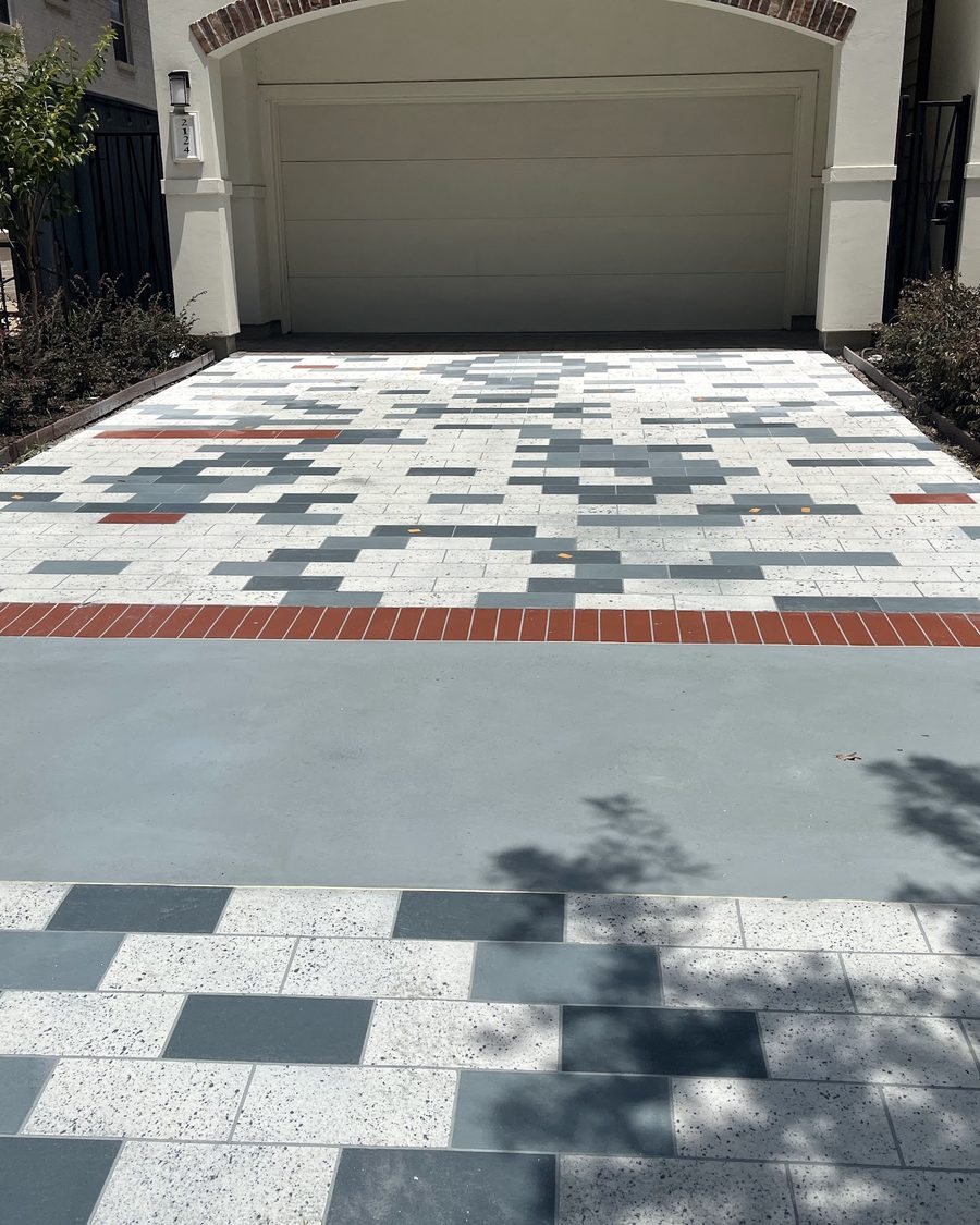 Finished decorative concrete overlay driveway in daylight