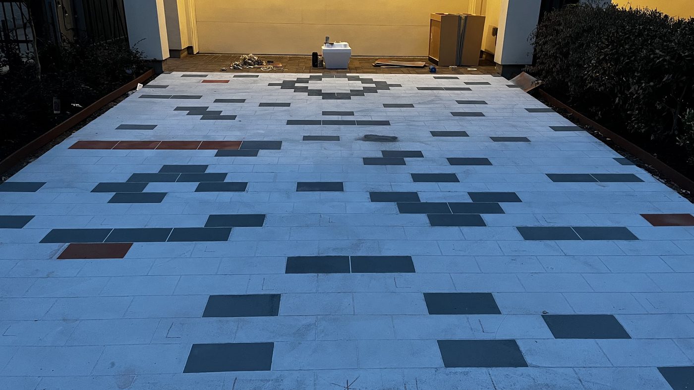 Isaac driveway overlay pattern seen from the garage at dusk