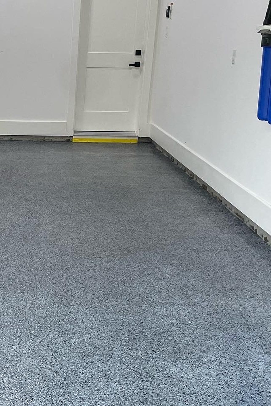 Grey flake garage floor installed by Astro Epoxy