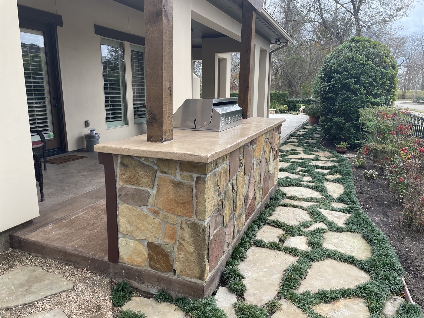 Finished outdoor kitchen concrete countertop viewed from the garden side