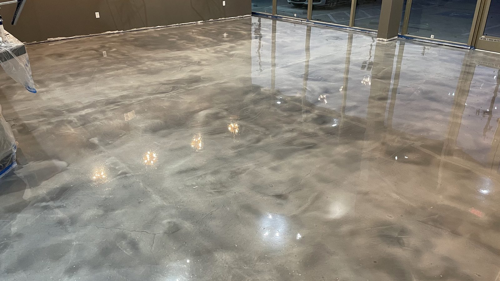 Large-scale metallic commercial floor installed by Astro Epoxy at The Spot EDO
