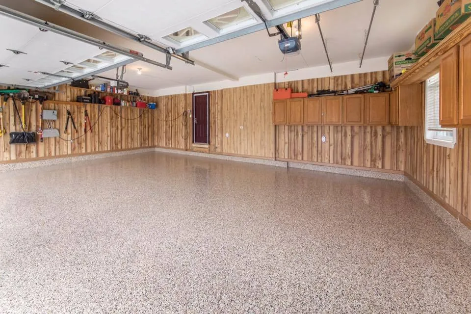 Finished tan and grey flake floor in a residential garage
