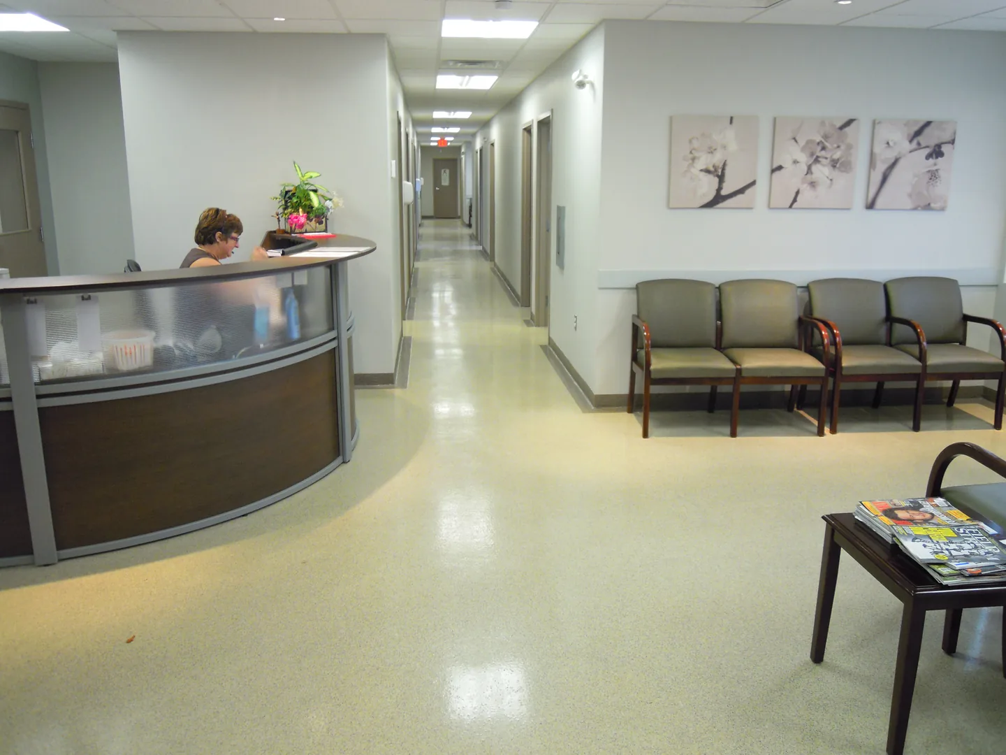 Light flake floor through a healthcare reception and corridor